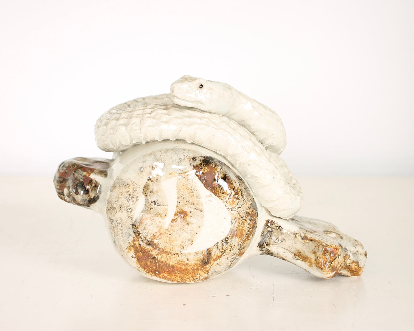 Vintage Japanese Ceramic Snake on a Mallet Sculpture