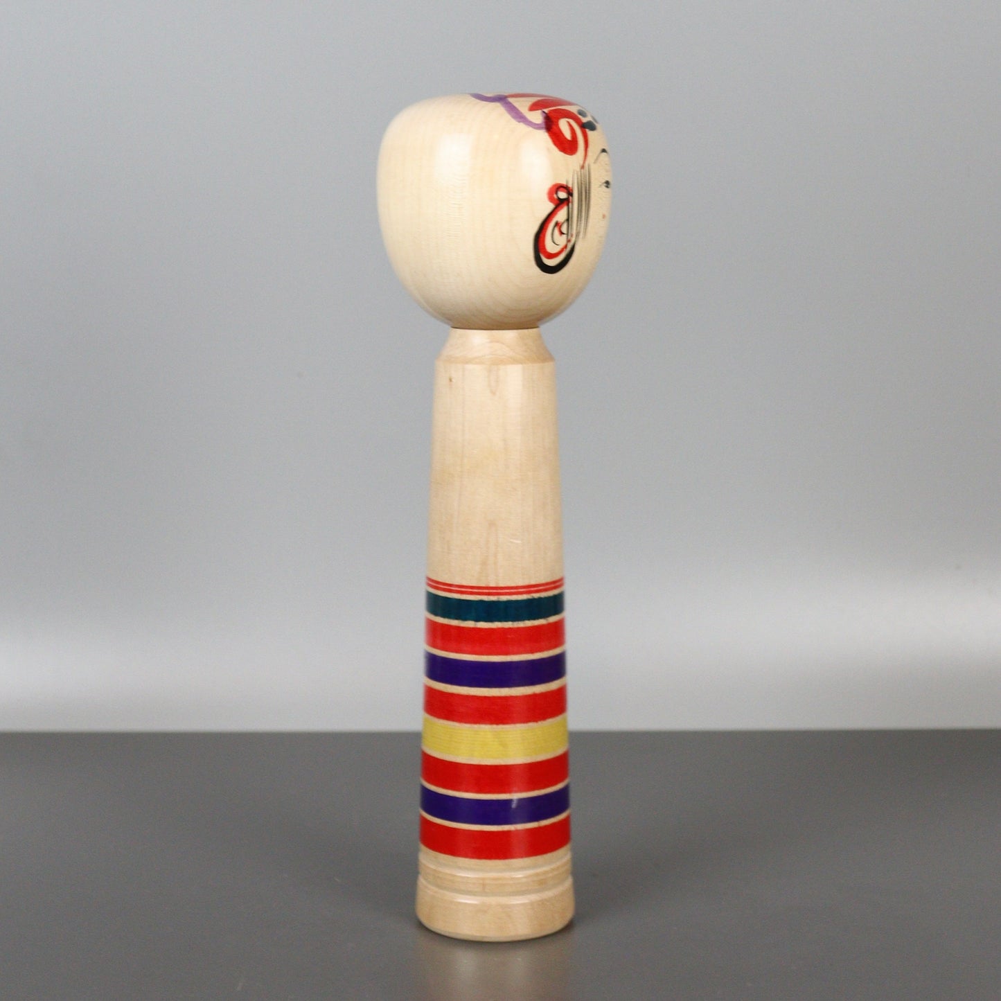 Musical Kokeshi Doll Colorful Stripes