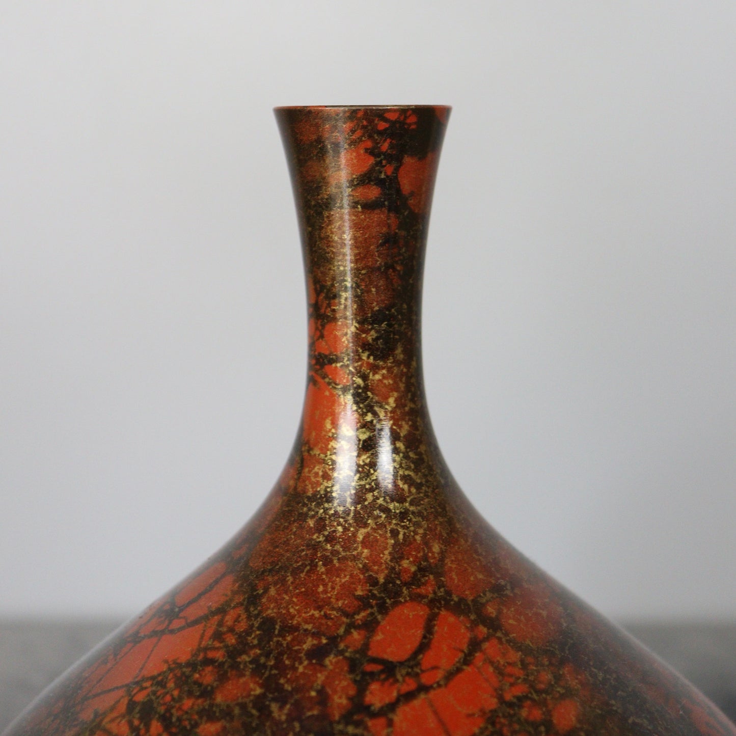 Reddish Orange and Black Bronze Vase with Gold lines